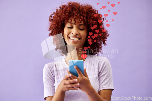 Image of Happy woman with phone, social media and like emoji in studio to love, subscribe and review on post. Smile, face and influencer on purple background with notification icon opinion on cellphone app.