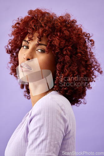 Image of Hair, portrait and woman in studio for beauty, wellness or texture treatment on purple background space. Natural haircare and face of female model with fun, red or afro, growth or profile dye results