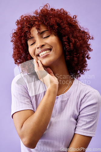 Image of Skincare, makeup and young woman in a studio for natural, cosmetic and glamour face routine. Beauty, smile and happy female model from Colombia with facial cosmetology treatment by purple background.