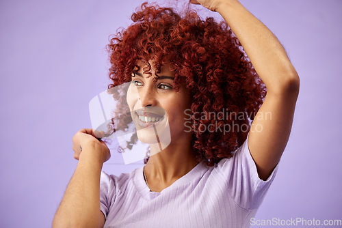 Image of Black woman, hair care and face with smile, natural afro and growth for glow and shine in studio on purple background. Wellness, person and healthy texture of cream and argon oil cosmetics indoor