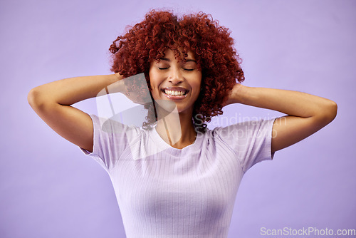 Image of Beauty, smile and woman with natural hair in studio for cosmetic, fun or care on purple background. Happy, haircare and face of lady model with red afro, dye and color, texture or growth satisfaction