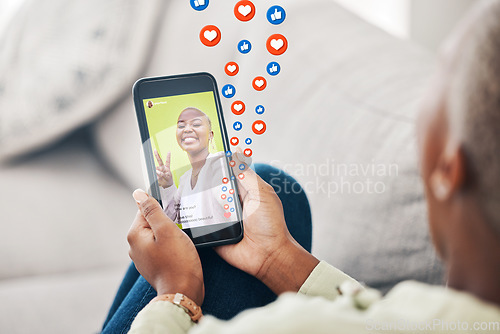 Image of Phone screen, hands and person with social media emojis, icons and watch video, app post or influencer. Home smartphone, peace sign and user streaming vlog, content creator and relax on lounge couch