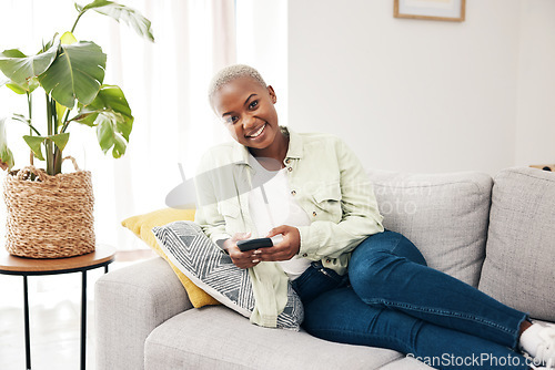 Image of Portrait, woman and typing with phone on sofa for social media, chat and online notification at home. Happy african person relax with smartphone, download mobile games or scroll on digital multimedia