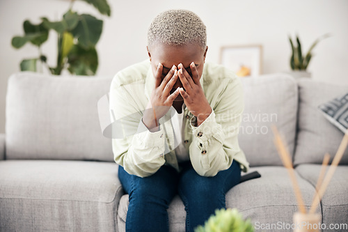 Image of Woman, depression and crying on sofa for anxiety, mental health and stress of bad mistake at home. Doubt, sad and frustrated african person scared of trauma, headache and counselling of broken heart