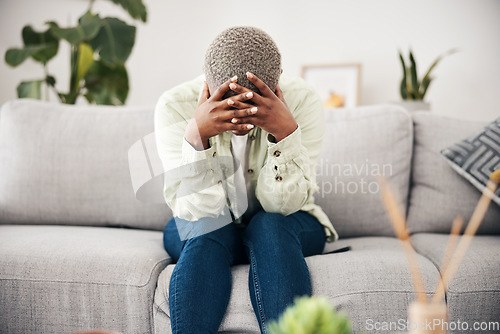 Image of Woman, headache and depression on sofa for mental health, anxiety and stress of bad mistake at home. Crying, sad and frustrated african person scared of trauma, worry and counselling of broken heart