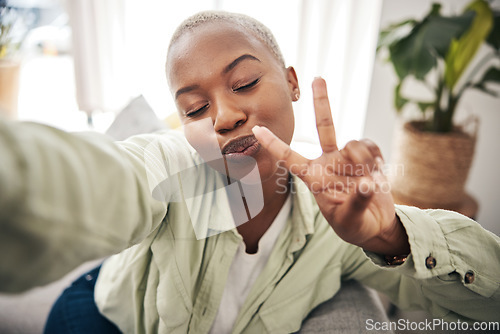 Image of Woman, face and peace for selfie in home while live streaming vlog, post update or broadcast. Happy african content creator, profile picture or show v sign with hand emoji for social media influencer