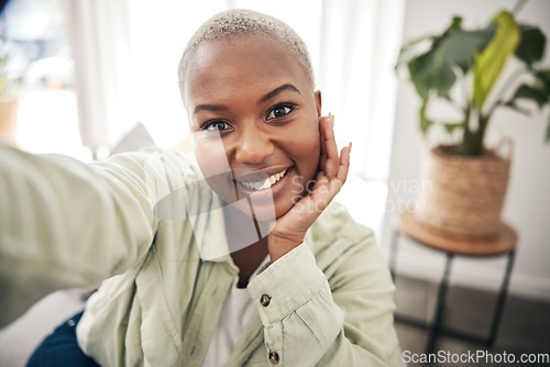 Image of Home, portrait or black woman taking a selfie with a happy smile on sofa to post on social media. Apartment, face or African person taking a photo, vlog or picture on couch in living room to relax