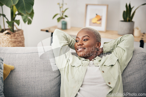 Image of Black woman, relax and calm stretching on sofa in home, living room and lounge with peace, happiness and rest on weekend. Happy, face and mindset of freedom in new house or apartment with homeowner