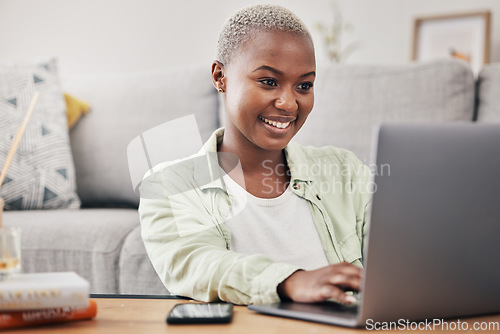 Image of Black woman, laptop and remote work in living room for elearning, subscription info and social media. Happy freelancer typing on computer to search internet website, online shopping and reading blog