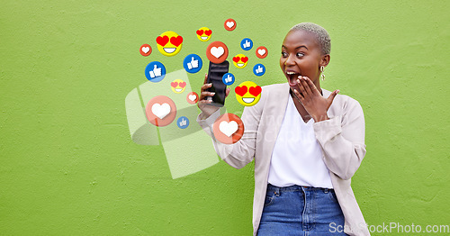 Image of Surprise, black woman and phone icons, social media emojis and wow facial expression for online notification. Wow opinion vote, mockup and shocked user reading chat feedback on green background wall