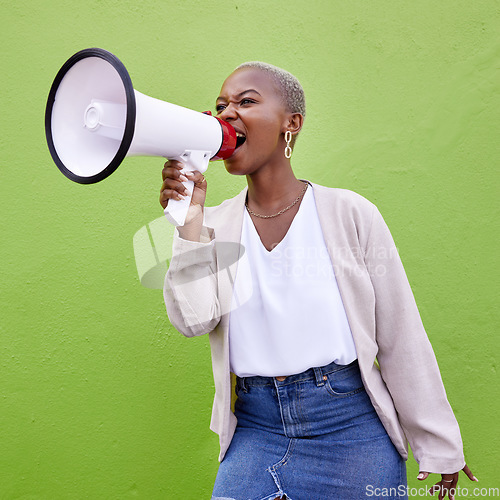 Image of Black woman, megaphone and loudspeaker on mockup space in advertising or protest against a studio background. African female person screaming in bullhorn or shouting for sale discount, vote or alert
