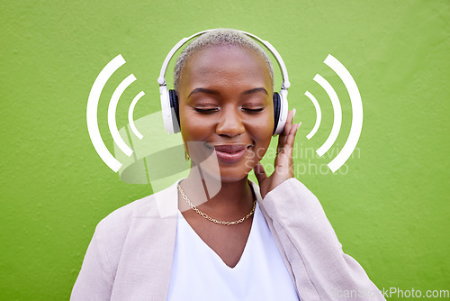 Image of Music, headphones and happy black woman listening on green wall background overlay. Radio, smile and African person streaming podcast, hearing audio and sound of jazz media for freedom of technology
