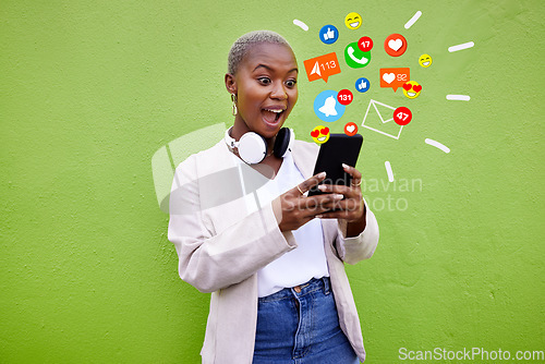 Image of Surprise, black woman and reading phone emojis, social media icons and wow facial expression for networking notification. App opinion, cellphone communication or shocked user on green background wall