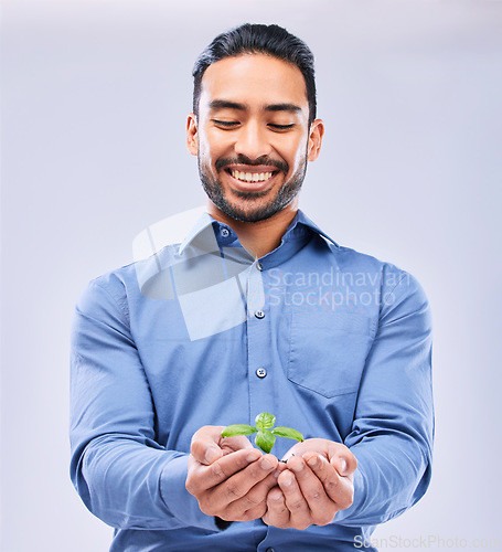 Image of Corporate, sustainability and businessman happy with NGO or agro growth isolated in a studio white background. Palm, startup and entrepreneur with soil and plant as an investment or climate change