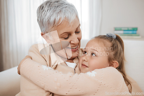 Image of Love, couch, and child hug grandmother in a home for bonding, care and relax together for travel or road trip. Senior, sofa and elderly person or grandparent with girl kid as family on retirement