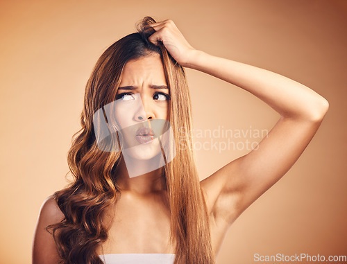 Image of Hair, frustrated and upset woman with beauty and frustrated from salon treatment and Brazilian fail. Studio, brown background and model with damage from split ends and shock of bad and messy haircut