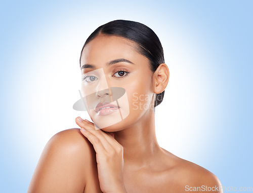 Image of Beauty, makeup and glow with portrait of woman in studio for cosmetics, spa and self care. Health, skincare and dermatology with natural face of person on blue background for facial in a salon