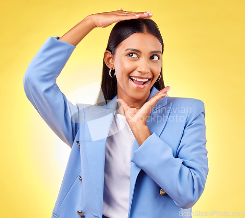 Image of Happy, business and hands of woman frame face in studio yellow background for creative perspective or unique thinking. Indian model, hand and entrepreneur with idea for corporate startup in Mumbai