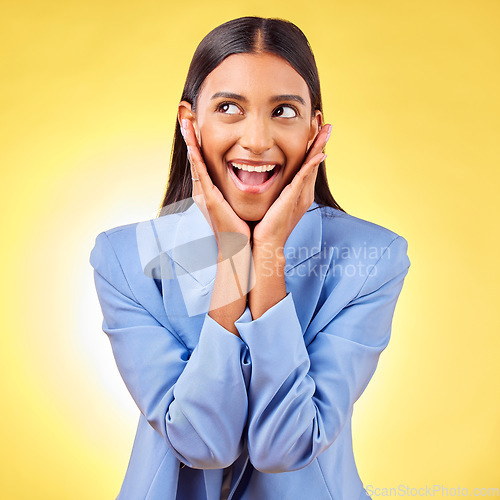 Image of Happy, business woman and hands on face in studio yellow background for creative perspective or unique thinking. Indian, model and excited entrepreneur with ideas for corporate startup in Mumbai