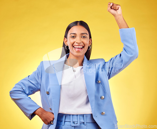 Image of Fist, success and portrait of business woman in studio for pride, professional and champion. Empowerment, power and strong with person on yellow background for celebration, achievement and winner