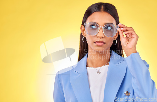 Image of Thinking, woman and face with sunglasses in studio, yellow background and mockup space with confident model with style. Stylish, frames and gen z person with an idea with cool fashion or glasses