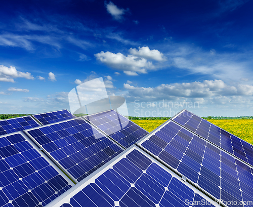 Image of Solar battery panels in rural meadow field