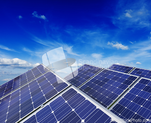 Image of Solar battery panels under blue sky