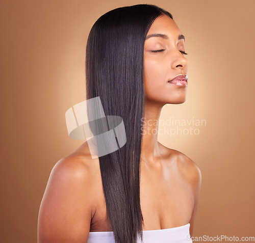 Image of Beauty, straight hair and skincare with face of woman in studio for keratin, salon treatment and texture. Shampoo, health and growth with model on brown background for glamour, shine and hairstyle