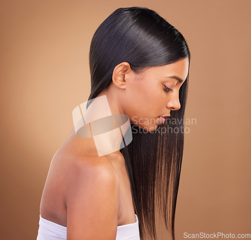 Image of Beauty, hair and skincare with profile of woman in studio for keratin, salon treatment and texture. Shampoo, health and growth with face of model on brown background for glamour, shine and hairstyle