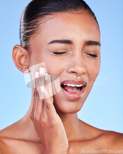 Image of Toothache, cavity and a woman with mouth pain on a blue background with a dental emergency. Sad, accident and a girl with problem with a teeth injury, gingivitis or inflammation of a gum