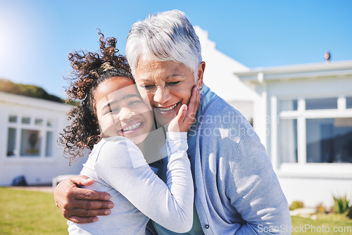 Image of Hug, home and grandmother with child in a garden and travel together on outdoor holiday for happiness. Vacation, smile and elderly grandparent with girl kid or grandchild for love, care and support