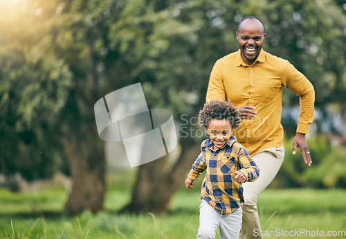 Image of Happy father, running and child at a park with freedom to playing in nature together on holiday. Love, energy or excited kid in a forest with an African father bonding with fun active games and smile