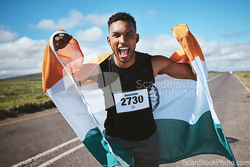 Image of Celebration, portrait and man with flag of India or runner on a road in nature for success in race, competition or marathon. Sports, winner and athlete cheering for cardio, running or achievement