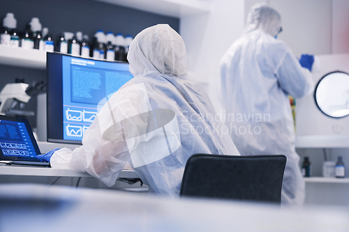 Image of Future, research and science team in an investigation of hazard, virus and in a chemistry laboratory with computer. DNA, collaboration and medical scientist working on biotechnology experiment