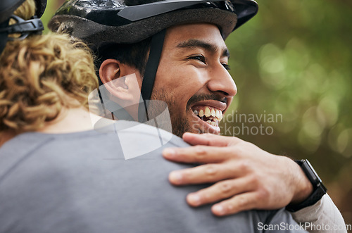Image of Hug, smile and cycling with friends in nature for fitness, health and partnership. Teamwork, motivation and sports adventure with men training in forest for wellness, workout and freedom together