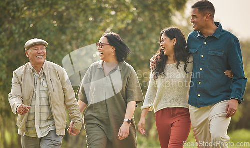 Image of Love, walking and happy with big family in park for bonding, support and summer. Vacation, happiness and holiday with people relax in grass field in nature for peace, generations or care together