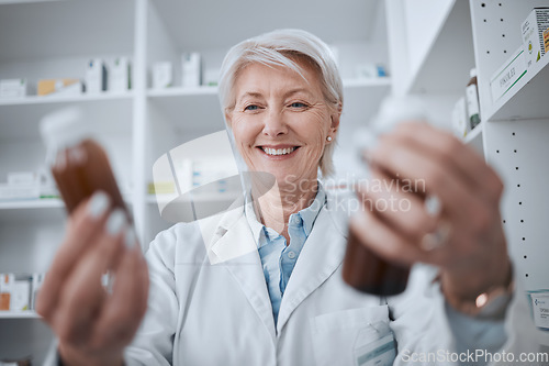 Image of Happy senior woman, pharmacist and medicine for inventory inspection or checking stock on shelf at store. Mature female person, medical or healthcare worker reading pharmaceutical product at pharmacy