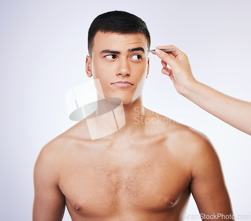 Image of Man, tweezer and skincare with doubt and beauty treatment for epilation and wellness in studio. Male model, dermatology and hair removal tool for eyebrows pull and hand on face with white background