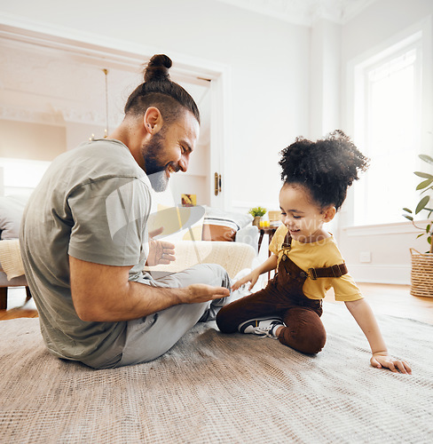 Image of Happy family, father and child with hand game on floor of living room for learning, love and development. Smile, person and kid on ground in lounge of apartment for relax, happiness and care