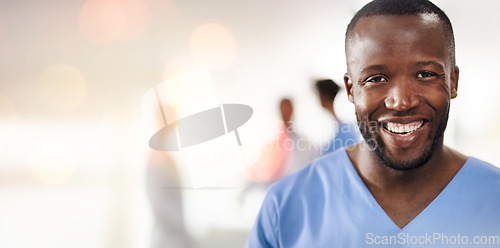 Image of Black man, doctor and portrait in clinic with space for mockup, healthcare and wellness with bokeh. Happy African medic, excited and pride for job in hospital, surgery and nursing for health in Kenya