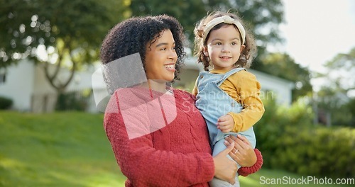 Image of Family, kids and a mother with her adopted daughter in the garden of their foster home together. Love, smile and children with a stepmother holding her female child outdoor in the home backyard