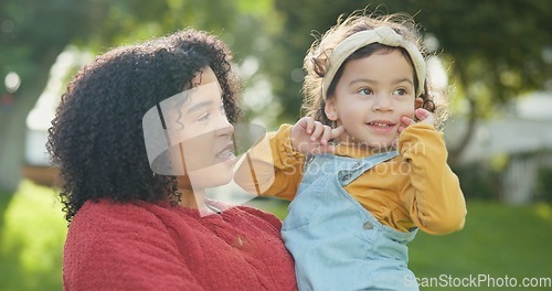 Image of Family, children and a woman with her adopted daughter in the garden of their foster home together. Love, smile and kids with a happy mother holding her female child outdoor in the home backyard