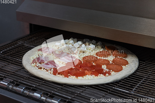 Image of Preparing pizza in oven