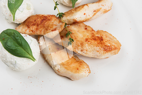 Image of Grilled chicken breast with mozzarella cheese.