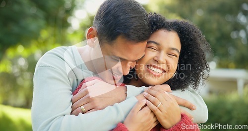 Image of Love, smile and a married couple hugging in the garden of their home together for romance during summer. Spring, dating and smile with happy young people in the backyard while bonding in spring