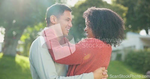 Image of Hug, backyard and couple with love, peace and bonding with quality time, romantic and happiness. Romance, man and woman outdoor, park and loving together in a park, embrace and support with care