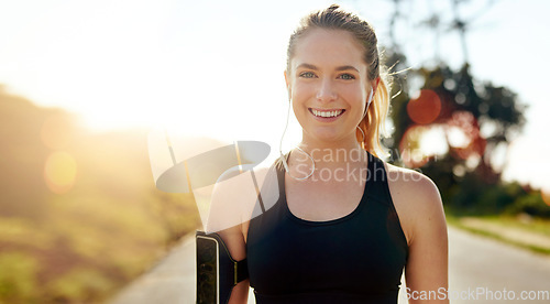 Image of Fitness, portrait and happy woman with earphones outdoor on road at sunrise, training workout or exercise. Listening to music, smile and face of athlete in nature for wellness, healthy body or sport