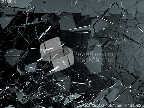 Image of Pieces of glass broken or cracked on black