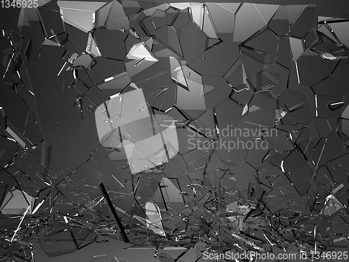 Image of Pieces of glass broken or cracked on black