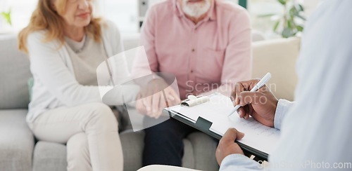 Image of Holding hands, support and senior couple with therapist for counseling, help and support for difficult, crisis or cancer diagnosis. Therapy, depression and old people consulting mental health expert